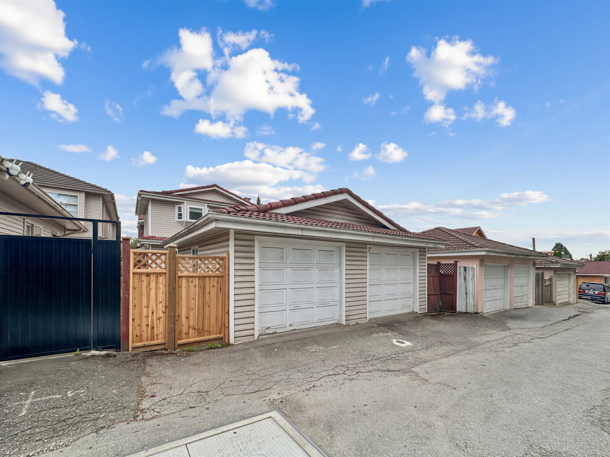 The lane behind the property with a row of garages